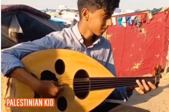 In the heart of Gaza's resilience, a Palestinian child sings a mournful Arabic song by Kadim Al Sahi